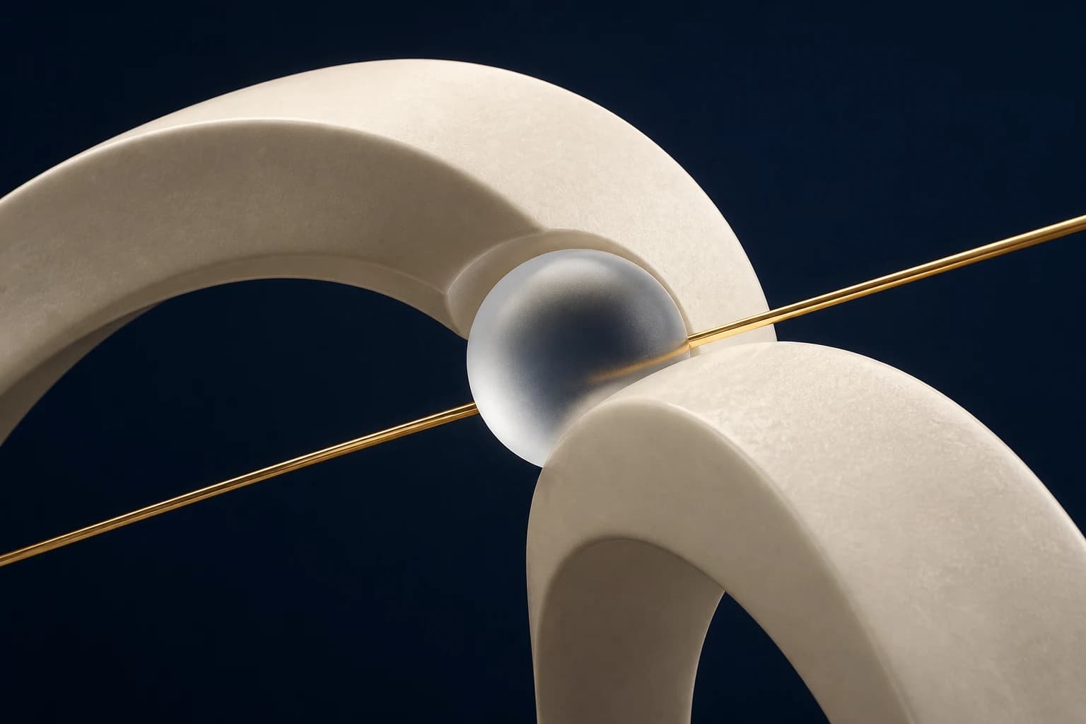 Broad ivory arcs meet around a frosted articulation sphere and champagne axis